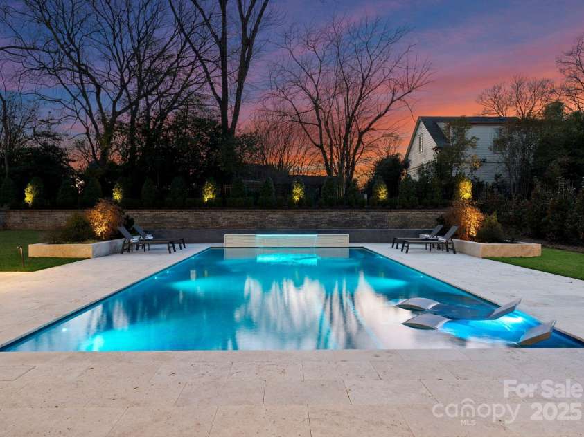 2103 Cortelyou Road, Charlotte, NC 28211.  MLS# CAR4214661, YatesRealty ID 17880. Twilight of Beautiful Custom Pool 
