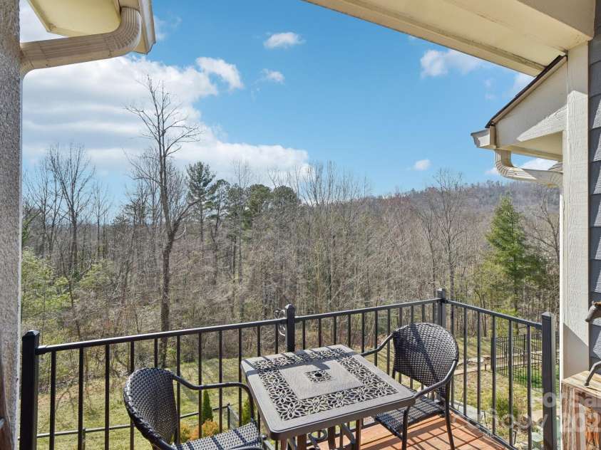 22 Thornes Lane, Asheville, NC 28805.  MLS# CAR4222972, YatesRealty ID 17882. Back balcony with view of mountains