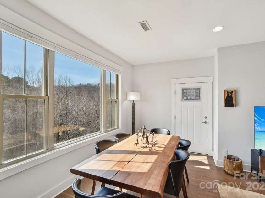 22 Thornes Lane, Asheville, NC 28805.  MLS# CAR4222972, YatesRealty ID 17882. Beautiful dining table overlooking view