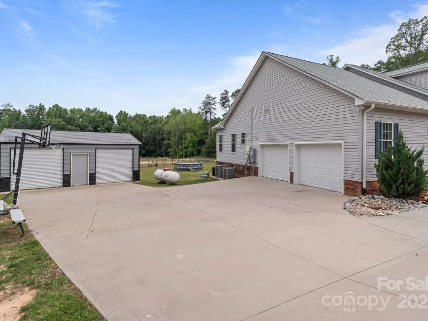 1230 Long Creek Lane, Salisbury, NC 28146.  MLS# CAR4258339, YatesRealty ID 17887. Attached 2 car, and detached 2 car garage.