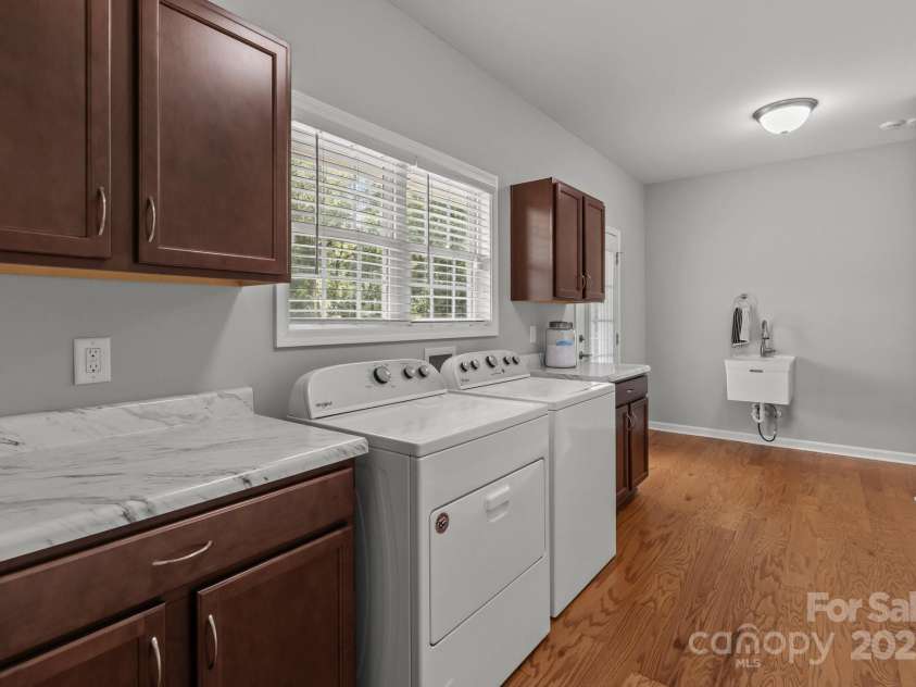 1230 Long Creek Lane, Salisbury, NC 28146.  MLS# CAR4258339, YatesRealty ID 17887. Laundry area with separate sink and cabinet space.