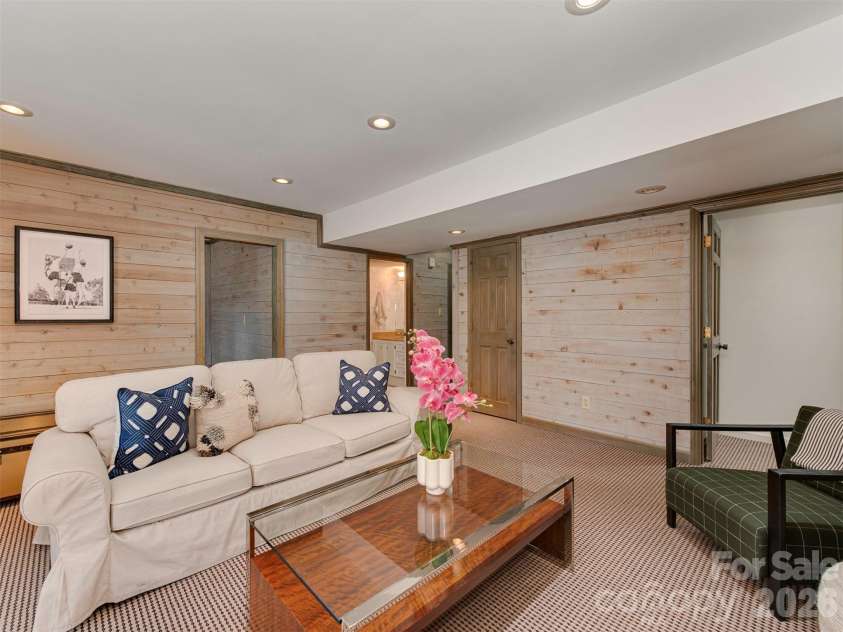 7244 Terrace Drive, Charlotte, NC 28211.  MLS# CAR4357695, YatesRealty ID 17887. Head downstairs and settle into a room that feels like a hug at the end of a long day---warm, welcoming, and effortlessly comfortable. This room is a whole vibe!