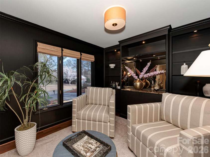 7244 Terrace Drive, Charlotte, NC 28211.  MLS# CAR4357695, YatesRealty ID 17887. Oh, the drama! This stunning room, drenched in a rich, moody black, makes the perfect receiving room or a striking home office.