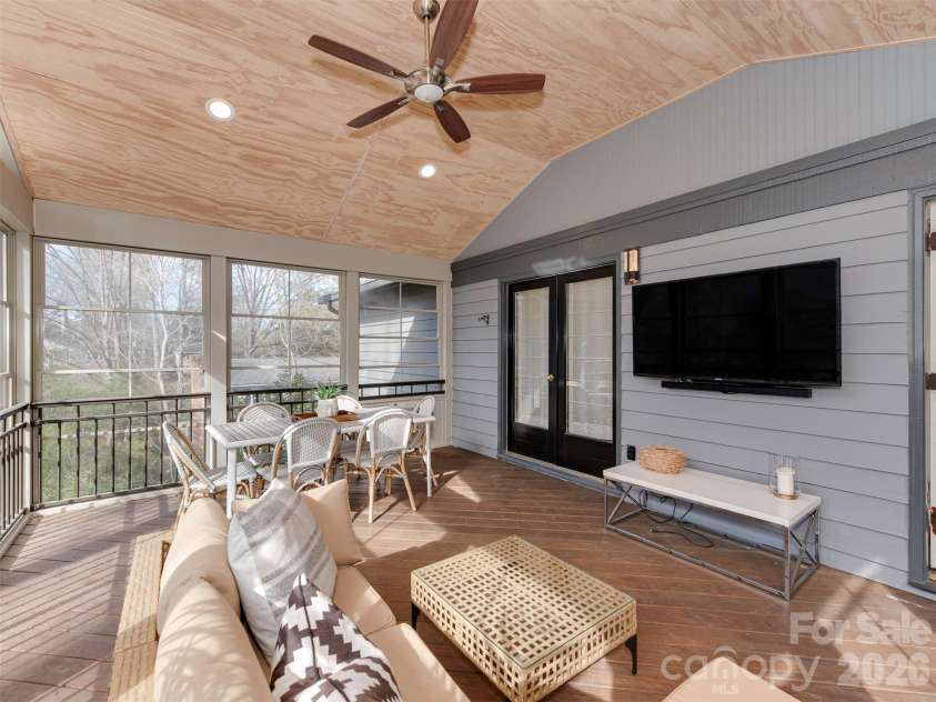 7244 Terrace Drive, Charlotte, NC 28211.  MLS# CAR4357695, YatesRealty ID 17887. Step right outside the living room, and onto this four season porch, to enjoy your favorite movie, catch the big game, or binge your latest series in a whole new setting.