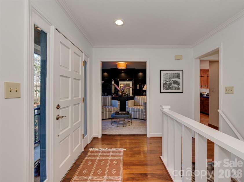 7244 Terrace Drive, Charlotte, NC 28211.  MLS# CAR4357695, YatesRealty ID 17887. Step through this recessed panel door, where accompanying sidelights fill the space with natural light and create a bright, warm, and inviting entrance to the home.