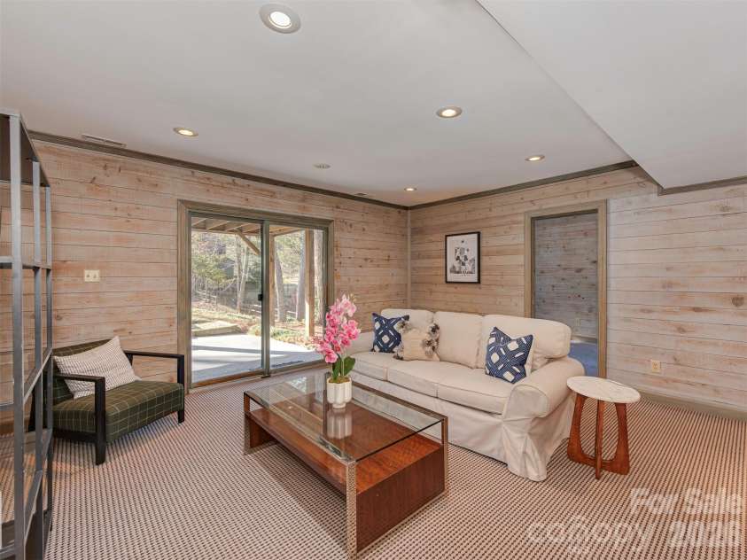 7244 Terrace Drive, Charlotte, NC 28211.  MLS# CAR4357695, YatesRealty ID 17887. The family room offers easy access to a covered patio, so the good vibes can flow seamlessly outdoors, too.