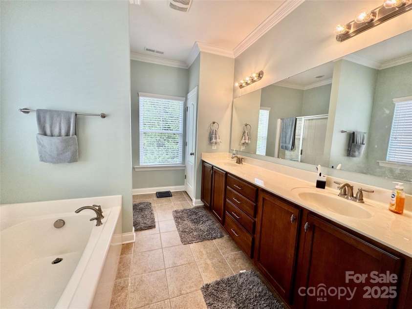 3678 Privette Road, Matthews, NC 28104.  MLS# CAR4258856, YatesRealty ID 17890. Primary bath