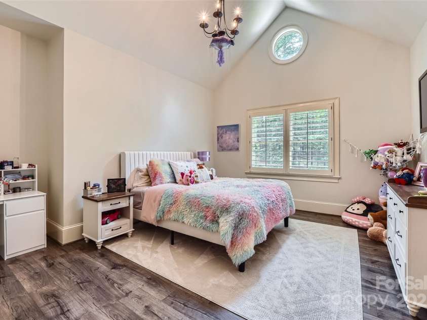 1056 James Madison Drive, Matthews, NC 28104.  MLS# CAR4260538, YatesRealty ID 17891. 3rd upstgairs bedroom with vaulted veiling and en-suite bath