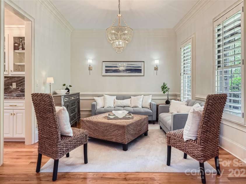 1056 James Madison Drive, Matthews, NC 28104.  MLS# CAR4260538, YatesRealty ID 17891. Formal dining room being used as sitting area