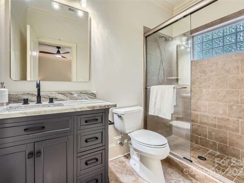 1056 James Madison Drive, Matthews, NC 28104.  MLS# CAR4260538, YatesRealty ID 17891. Full en-suite bath
