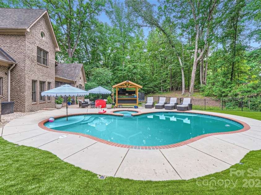 1056 James Madison Drive, Matthews, NC 28104.  MLS# CAR4260538, YatesRealty ID 17891. Gunite salt water pool and spa