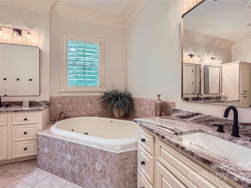 1056 James Madison Drive, Matthews, NC 28104.  MLS# CAR4260538, YatesRealty ID 17891. Primary bathroom