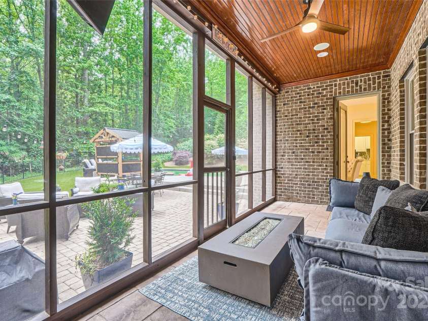 1056 James Madison Drive, Matthews, NC 28104.  MLS# CAR4260538, YatesRealty ID 17891. Screened porch of the primary bedroom