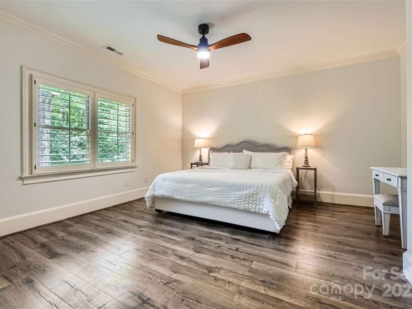 1056 James Madison Drive, Matthews, NC 28104.  MLS# CAR4260538, YatesRealty ID 17891. Upstairs bedroom with en-suite bath