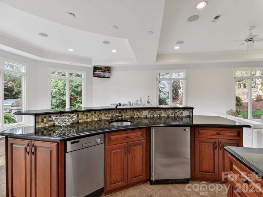 15615 McCullers Court, Charlotte, NC 28277.  MLS# CAR4367013, YatesRealty ID 17898. Bar with fridge and dishwasher
