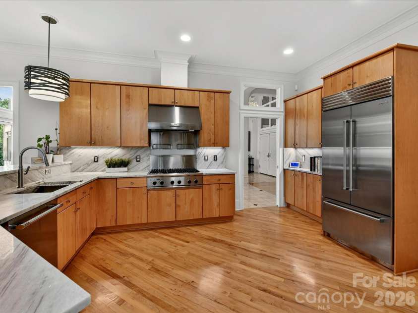 15615 McCullers Court, Charlotte, NC 28277.  MLS# CAR4367013, YatesRealty ID 17898. Stunning kitchen with newer quartz countertops and Subzero refrigerator