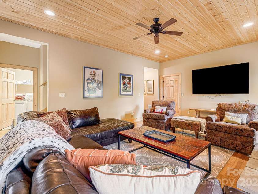 195 El Miner Court, Mars Hill, NC 28754.  MLS# CAR4174195, YatesRealty ID 179. Lower level living room with fireplace