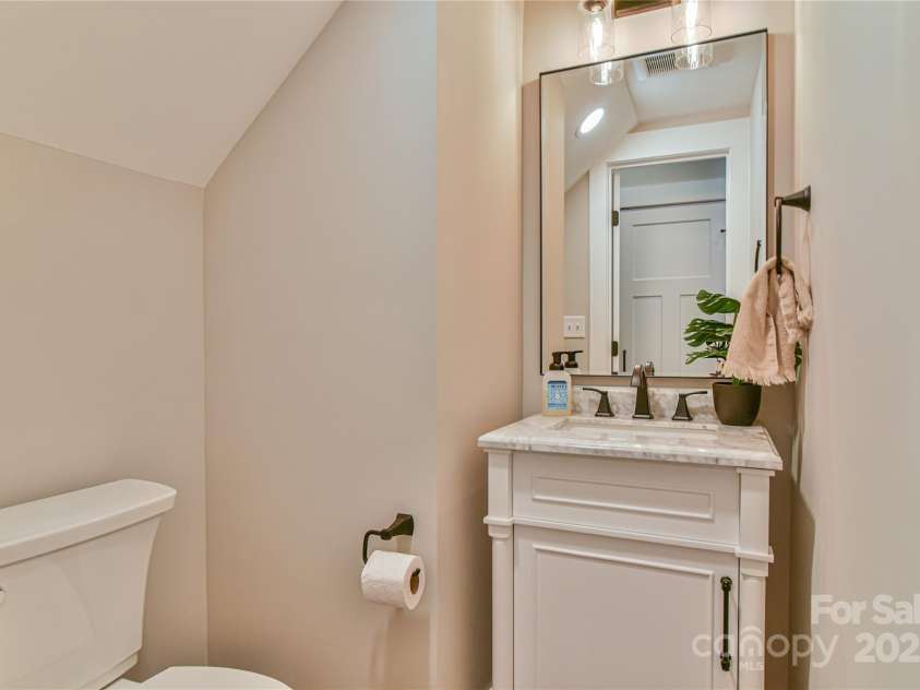 310 Portmanvilla Road, Black Mountain, NC 28711.  MLS# CAR4247899, YatesRealty ID 17910. Main level guest powered room