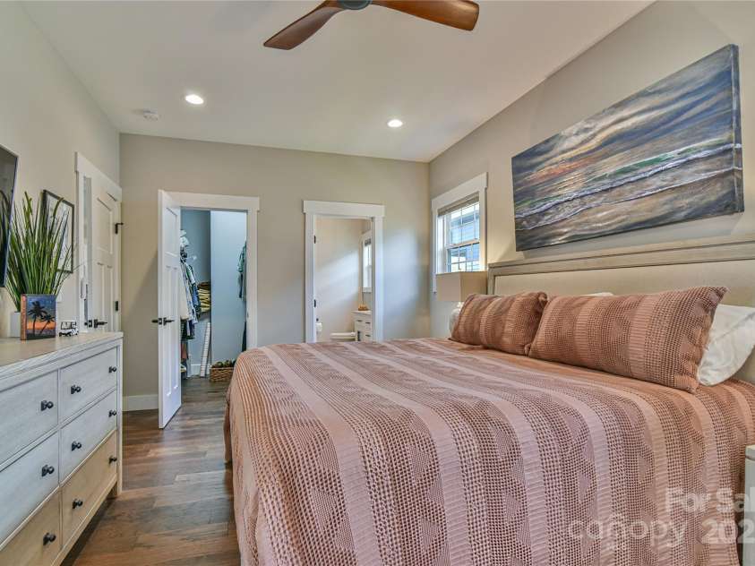 310 Portmanvilla Road, Black Mountain, NC 28711.  MLS# CAR4247899, YatesRealty ID 17910. Primary Bedroom on the main level with full ensuite and walk in closet as well as direct access to the back deck