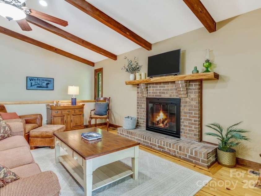 609 Haven Drive, Saluda, NC 28773.  MLS# CAR4247056, YatesRealty ID 17919. Great room with stairs to lower level in the back of the photo.