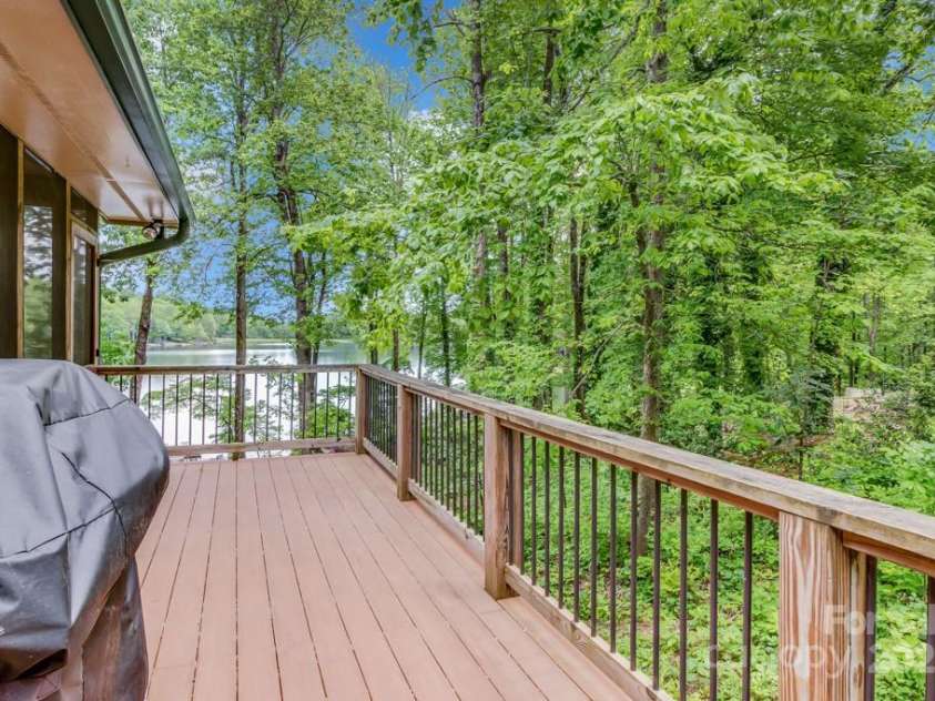 609 Haven Drive, Saluda, NC 28773.  MLS# CAR4247056, YatesRealty ID 17919. Large Wrap around deck with built in gas grill.