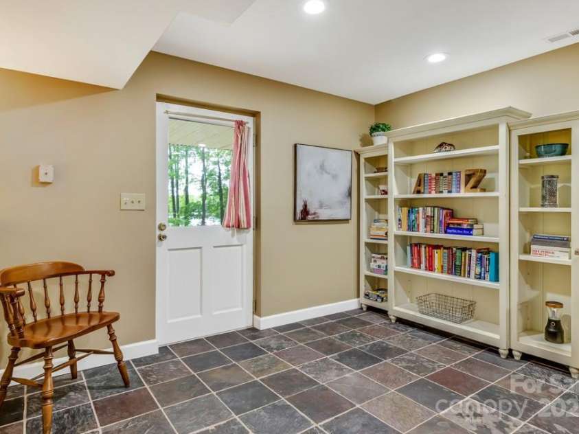 609 Haven Drive, Saluda, NC 28773.  MLS# CAR4247056, YatesRealty ID 17919. Lower level entry from lakeside