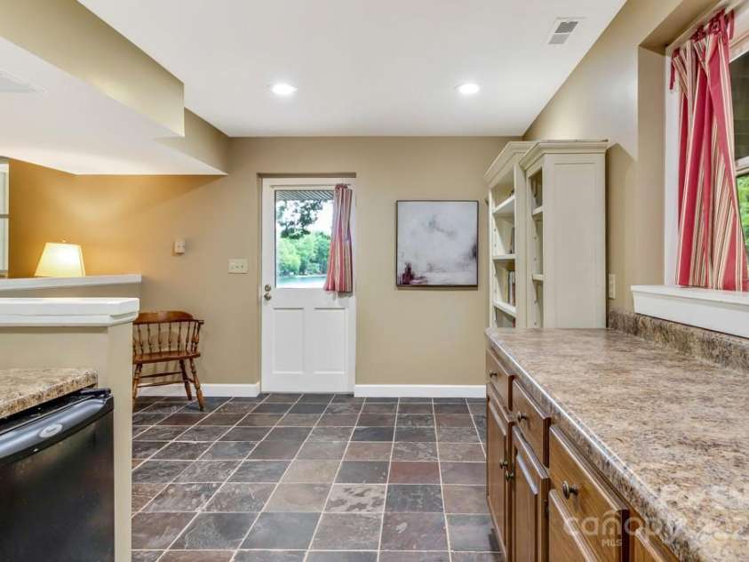 609 Haven Drive, Saluda, NC 28773.  MLS# CAR4247056, YatesRealty ID 17919. Lower level entry from lakeside