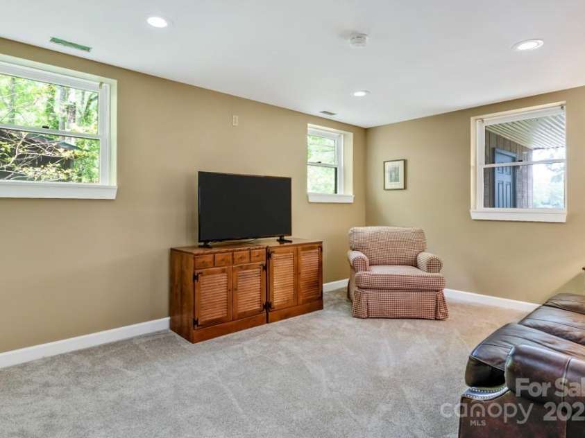 609 Haven Drive, Saluda, NC 28773.  MLS# CAR4247056, YatesRealty ID 17919. Lower level family room