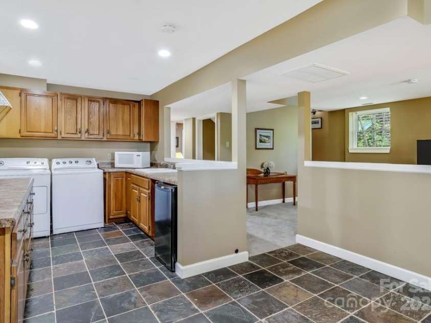 609 Haven Drive, Saluda, NC 28773.  MLS# CAR4247056, YatesRealty ID 17919. Lower level laundry/wet bar/extra kitchen space