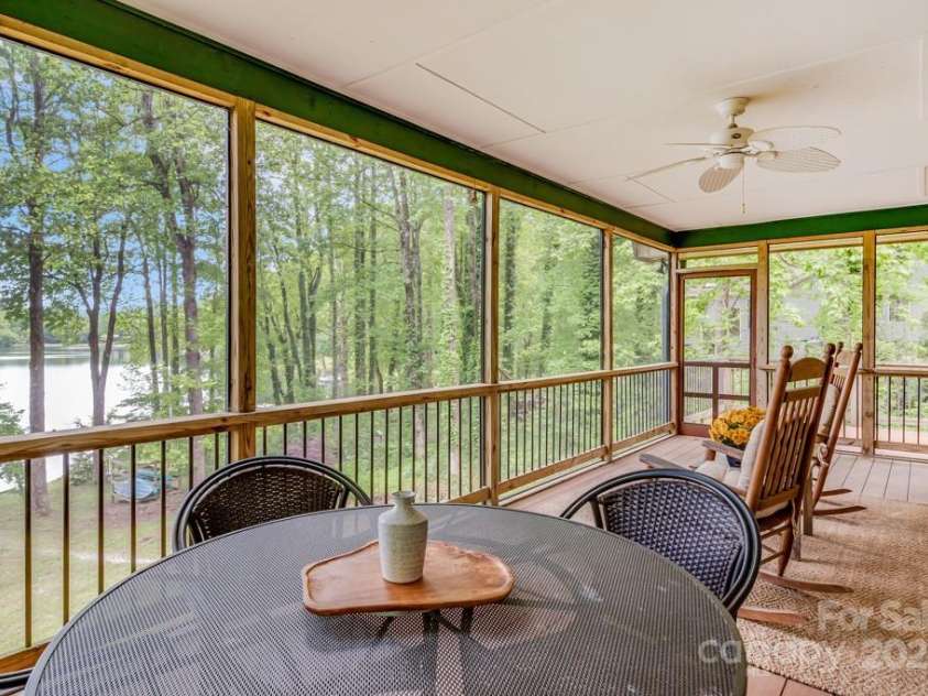609 Haven Drive, Saluda, NC 28773.  MLS# CAR4247056, YatesRealty ID 17919. Oversized screened porch is a room of its own.  Enjoy dining, rocking, napping, living out here.