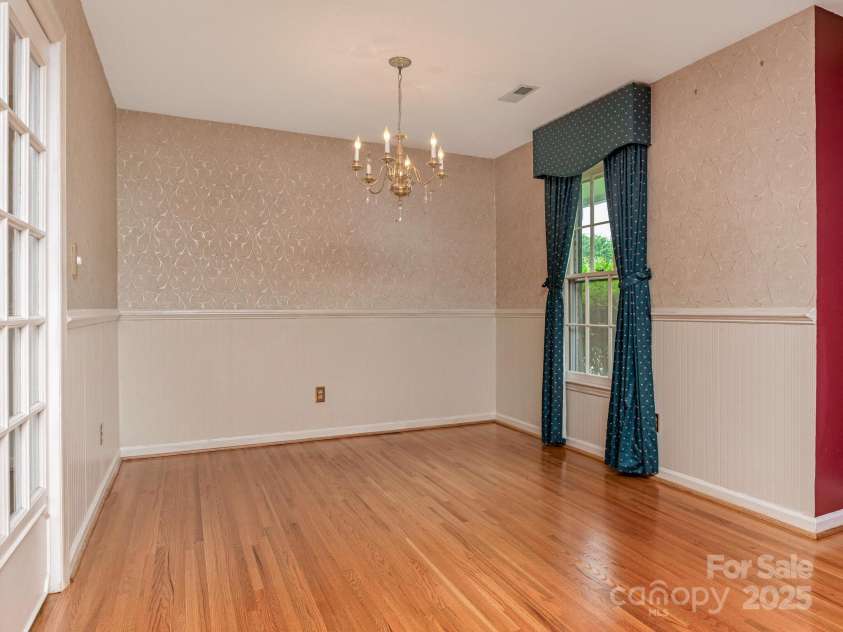 3408 Oak Tree Trail, Matthews, NC 28105.  MLS# CAR4267808, YatesRealty ID 17929. Dedicated Dining space with chandelier