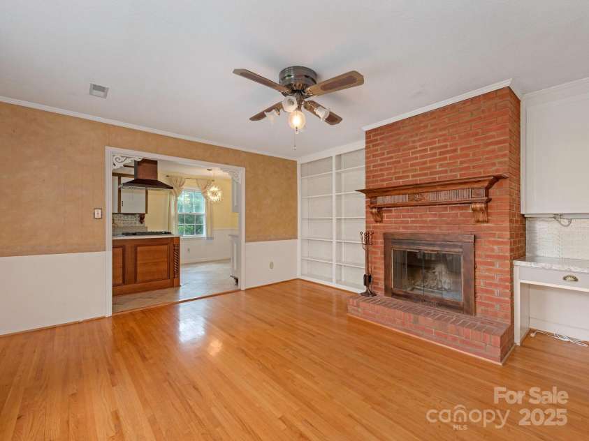 3408 Oak Tree Trail, Matthews, NC 28105.  MLS# CAR4267808, YatesRealty ID 17929. Den with gas fireplace and built in bookshelves
