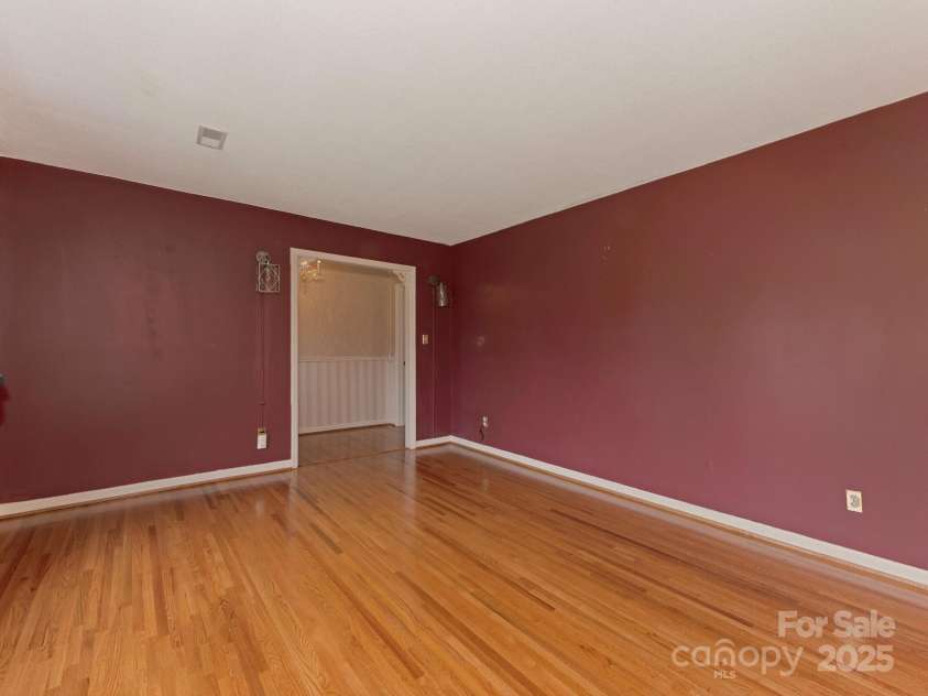 3408 Oak Tree Trail, Matthews, NC 28105.  MLS# CAR4267808, YatesRealty ID 17929. Front Living Area with gleaming hardwood floors, facing the front entrance hall