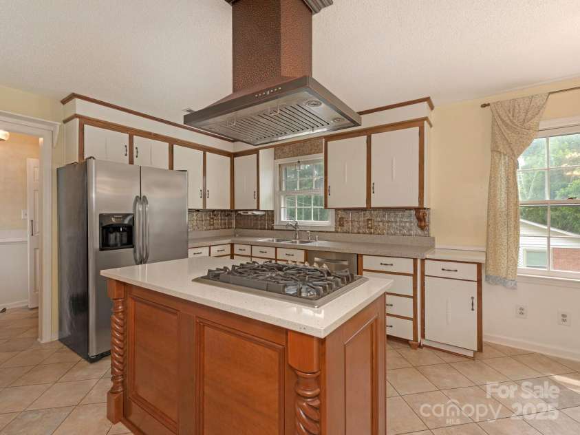 3408 Oak Tree Trail, Matthews, NC 28105.  MLS# CAR4267808, YatesRealty ID 17929. Kitchen with Bosch Refrigerator