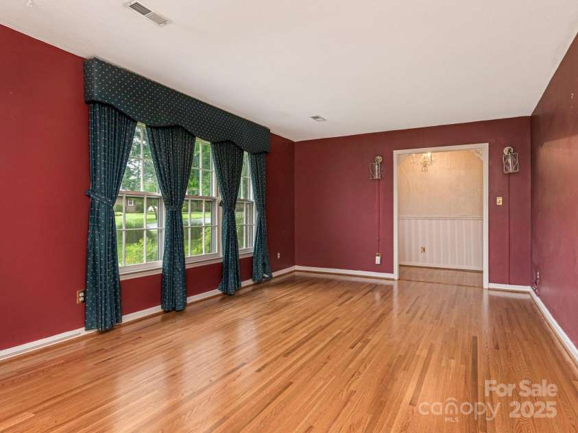 3408 Oak Tree Trail, Matthews, NC 28105.  MLS# CAR4267808, YatesRealty ID 17929. Living Room view from dining area to front all