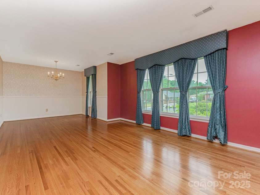 3408 Oak Tree Trail, Matthews, NC 28105.  MLS# CAR4267808, YatesRealty ID 17929. Living Room view from the front entry hall