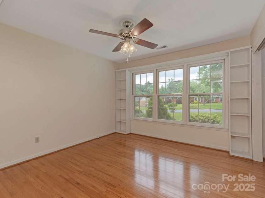 3408 Oak Tree Trail, Matthews, NC 28105.  MLS# CAR4267808, YatesRealty ID 17929. Spacious secondary bedroom with built in shelving