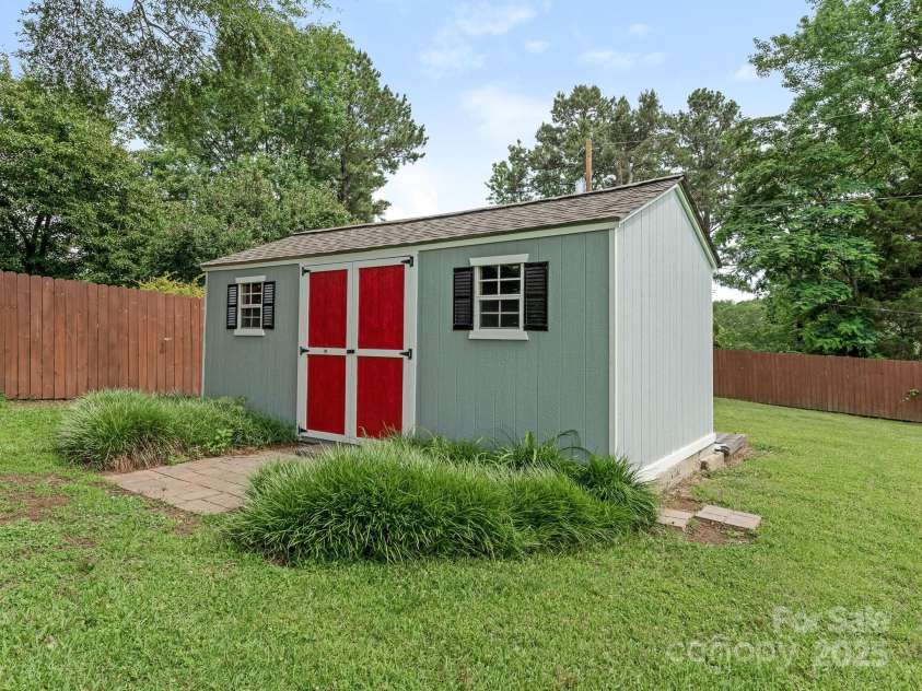 3408 Oak Tree Trail, Matthews, NC 28105.  MLS# CAR4267808, YatesRealty ID 17929. Storage shed in back yard