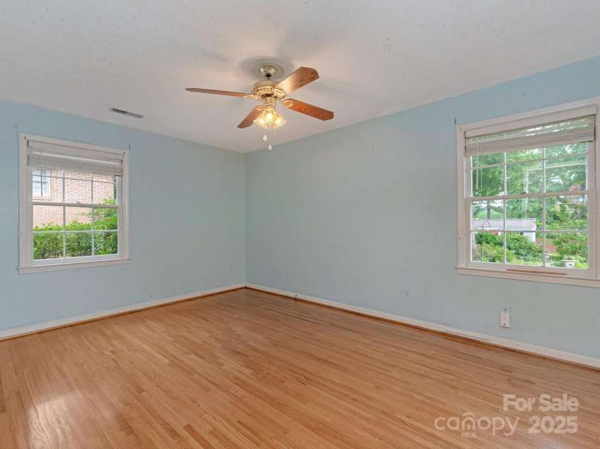 3408 Oak Tree Trail, Matthews, NC 28105.  MLS# CAR4267808, YatesRealty ID 17929. Sunlit primary bedroom