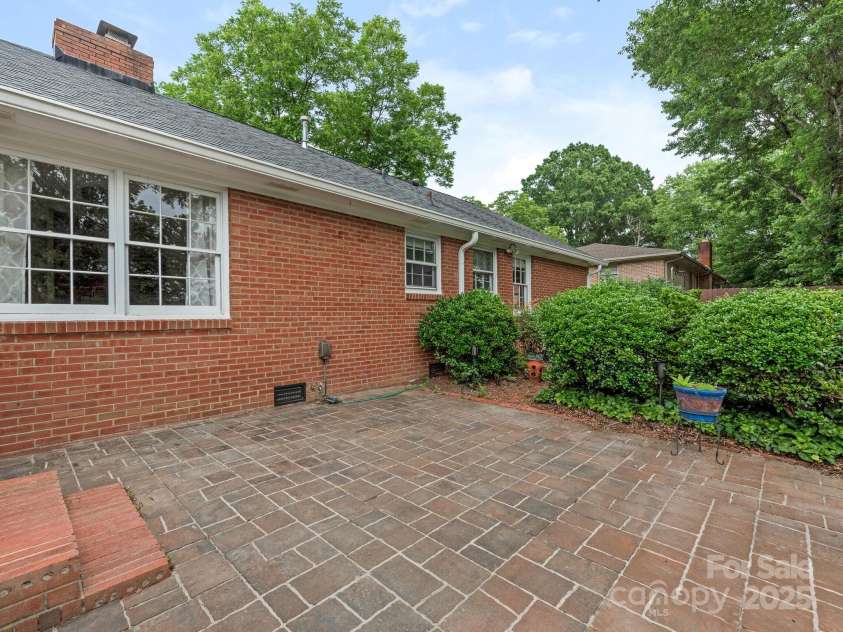 3408 Oak Tree Trail, Matthews, NC 28105.  MLS# CAR4267808, YatesRealty ID 17929. View of steps to patio from the rear entrance