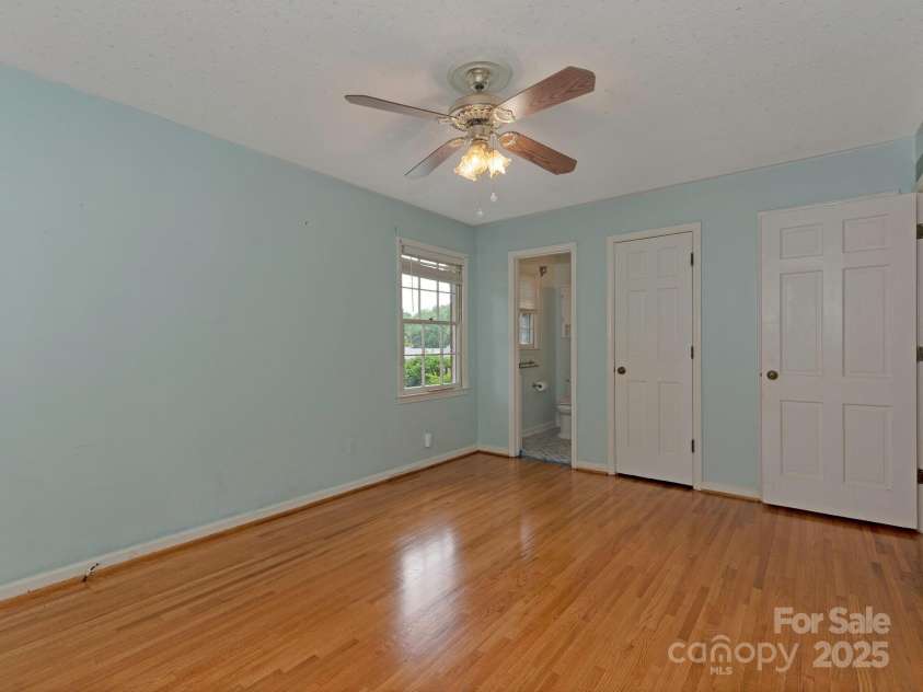 3408 Oak Tree Trail, Matthews, NC 28105.  MLS# CAR4267808, YatesRealty ID 17929. View to primary bath from primary bedroom