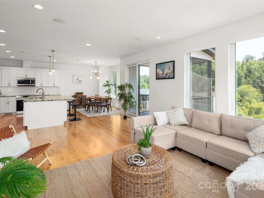 303 Iron Ridge Loop, Asheville, NC 28806.  MLS# CAR4151239, YatesRealty ID 1793. Main Level Living Room Open to Kitchen and Dining