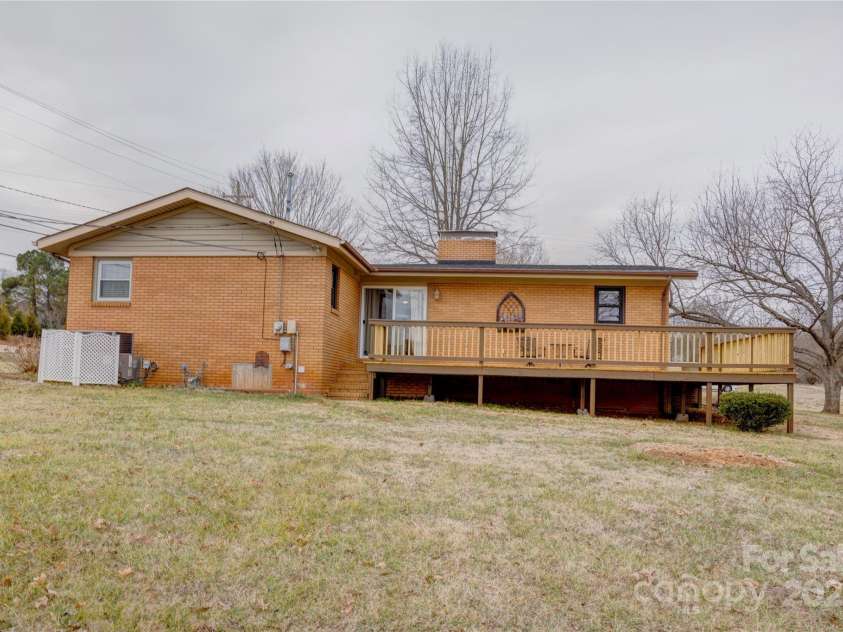 2004 Grandhaven Drive, Concord, NC 28027.  MLS# CAR4220214, YatesRealty ID 17934. New deck wraps from side and back of home