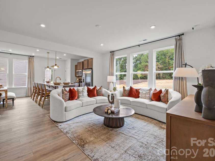 2226 Gladwyne Place, Charlotte, NC 28269.  MLS# CAR4336830, YatesRealty ID 17934. Representative Photo from Model - Main level living area