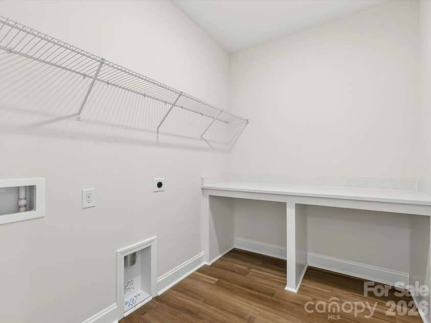 356 Portree Street, Rock Hill, SC 29732.  MLS# CAR4342039, YatesRealty ID 17935. Second Floor Laundry Utility with Folding Table