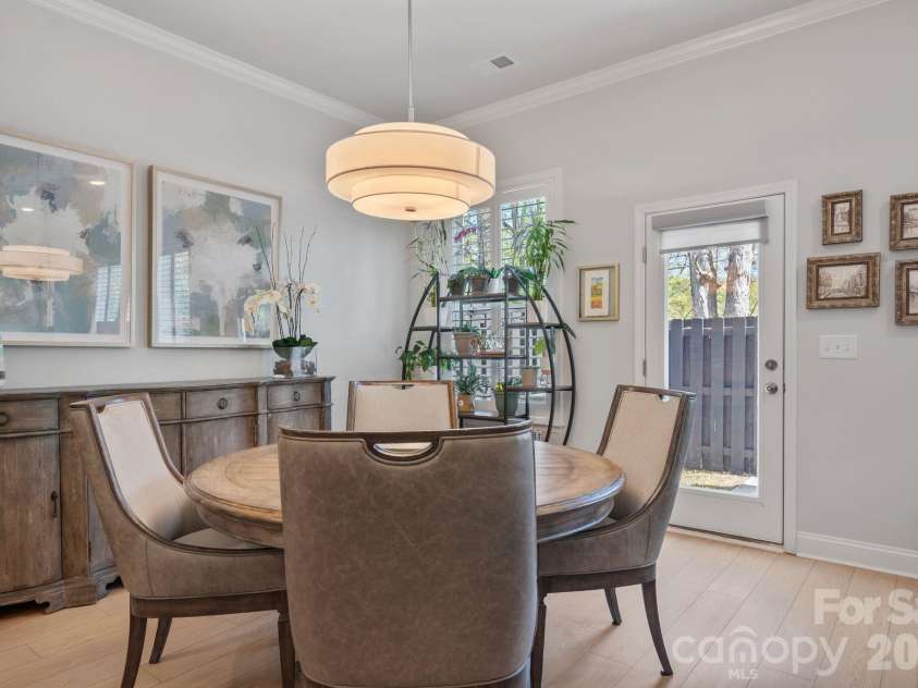 9043 Charles Francis Lane, Cornelius, NC 28031.  MLS# CAR4360316, YatesRealty ID 17944. Dining area with custom chandelier