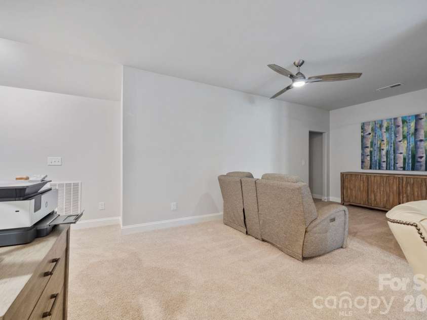 9043 Charles Francis Lane, Cornelius, NC 28031.  MLS# CAR4360316, YatesRealty ID 17944. Large walk-in storage area