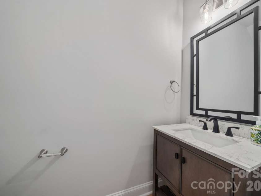 9043 Charles Francis Lane, Cornelius, NC 28031.  MLS# CAR4360316, YatesRealty ID 17944. Main level powder room