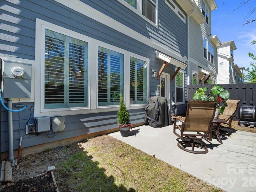 9043 Charles Francis Lane, Cornelius, NC 28031.  MLS# CAR4360316, YatesRealty ID 17944. Patio with green space
