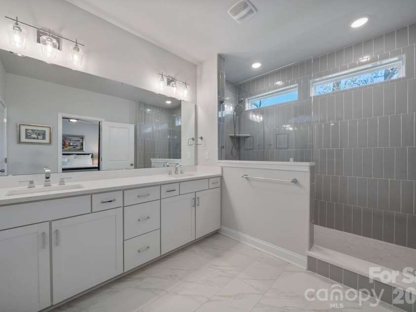 9043 Charles Francis Lane, Cornelius, NC 28031.  MLS# CAR4360316, YatesRealty ID 17944. Primary bathroom with dual vanities